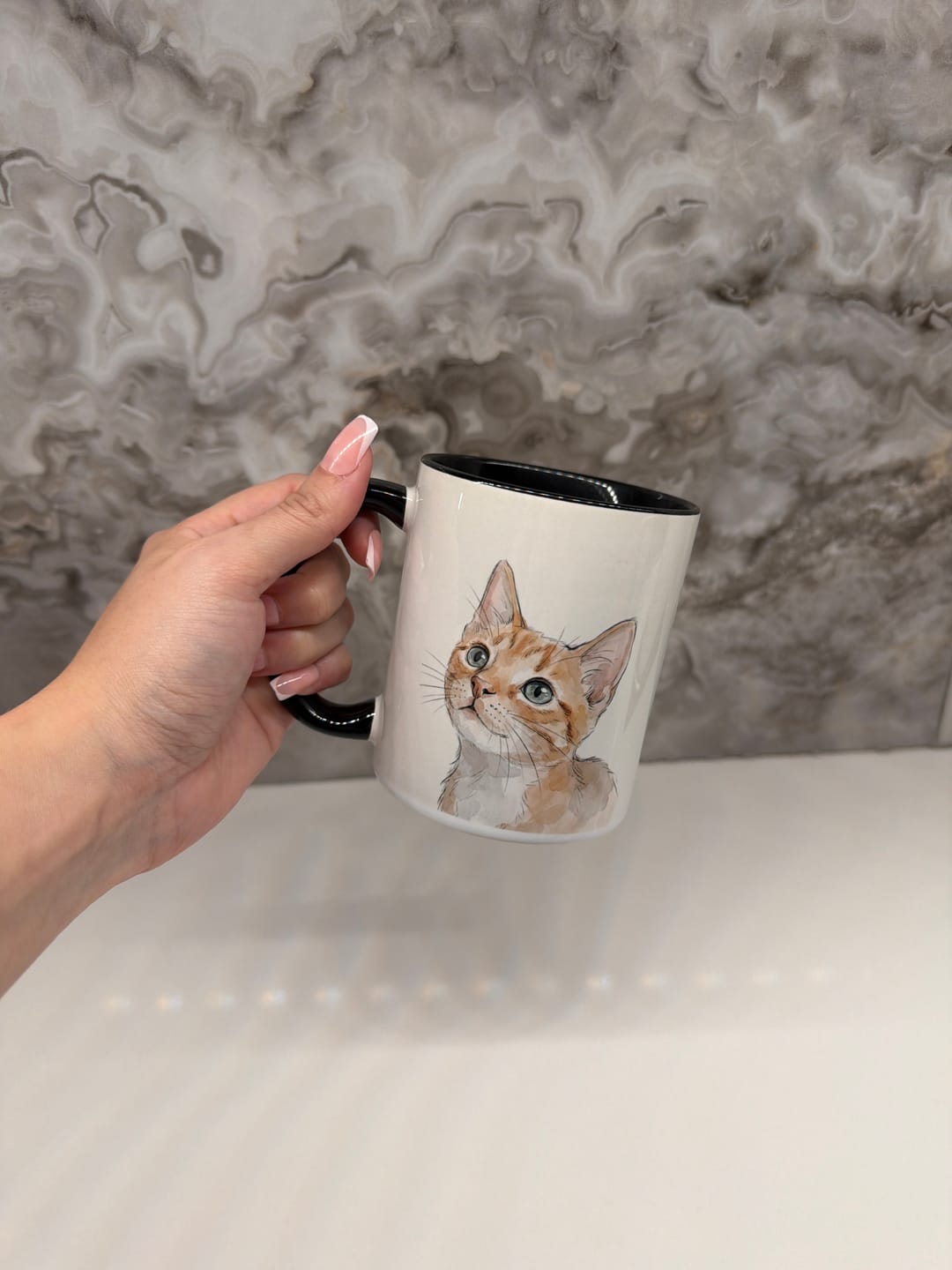 Cat portrait printed on a black mug