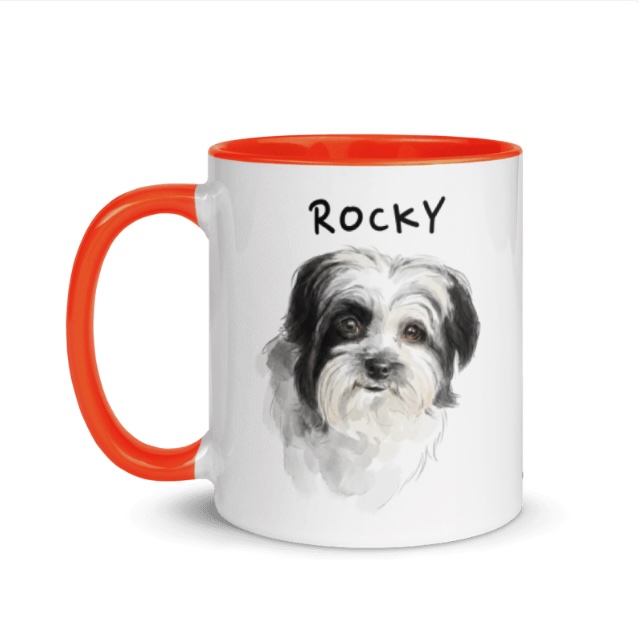 Watercolor portrait of Rocky the dog on an orange-handled mug