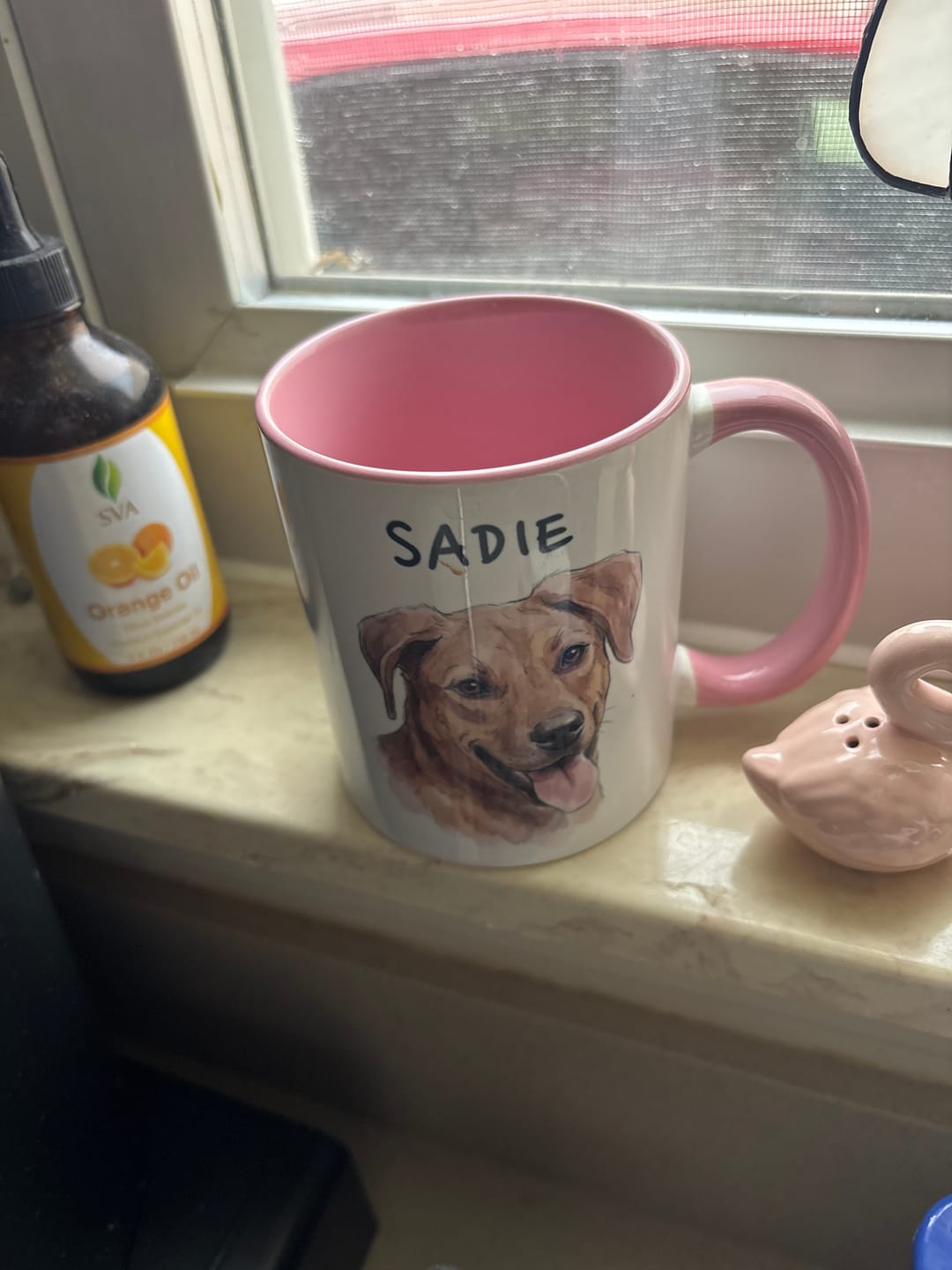 Sadie portrait printed on a pink mug